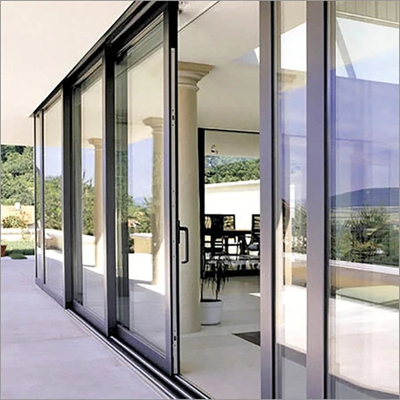 Puerta corredera de aluminio con doble acristalamiento panorámico avanzado y diseño de banda oculta